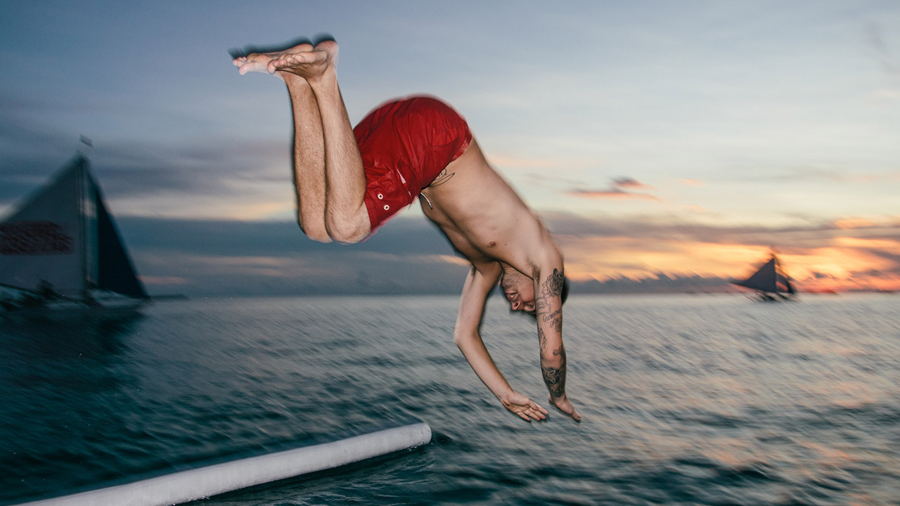 Man diving into ocean